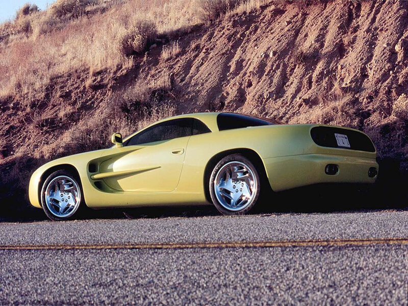 yellow sports car on road