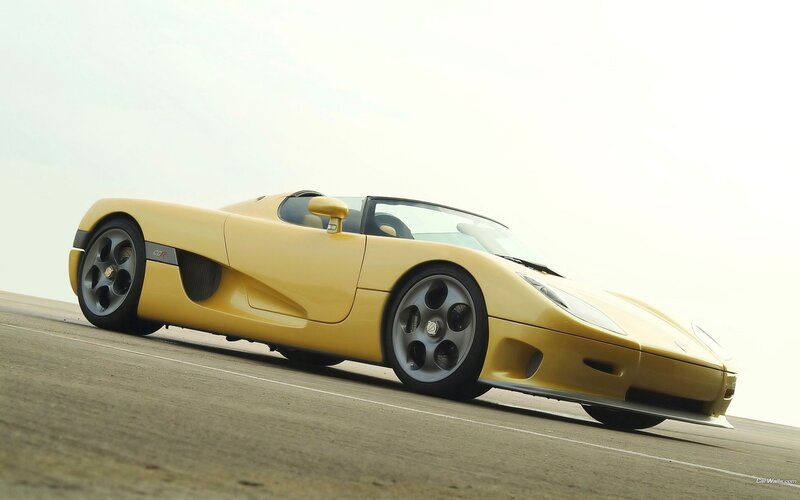 yellow sports car on track