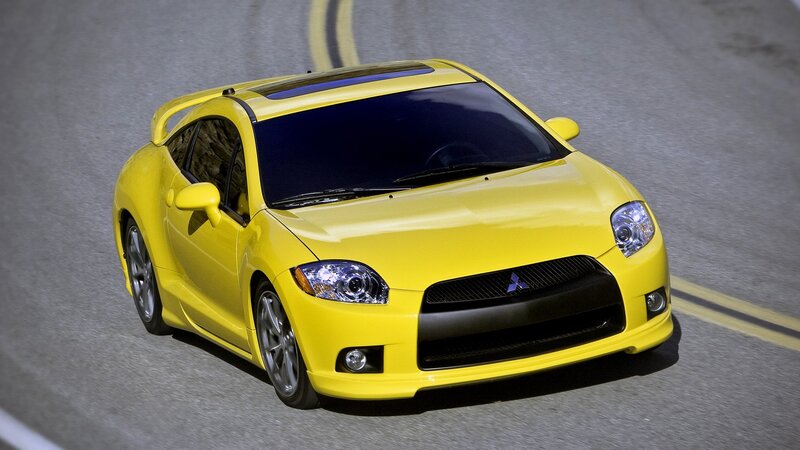 yellow sports car on track