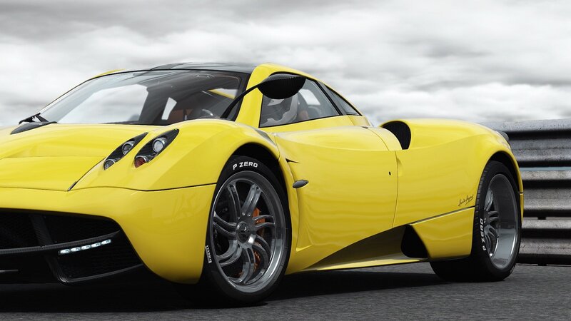 yellow sports car on track