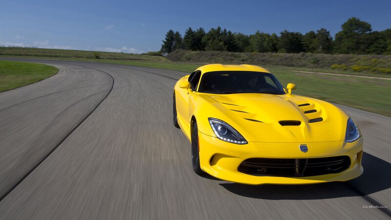 yellow sports car on track
