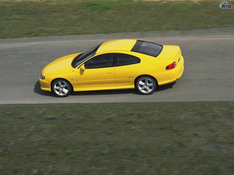 yellow sports car on track