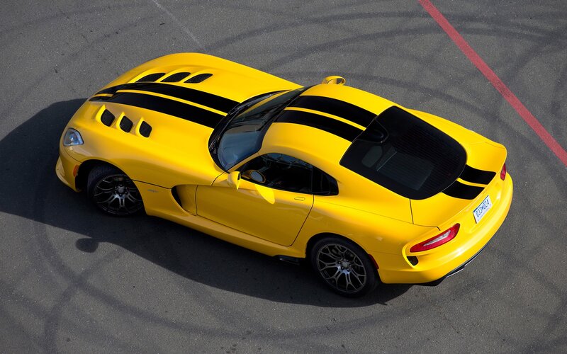 yellow sports car on track