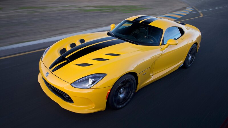 yellow sports car on track