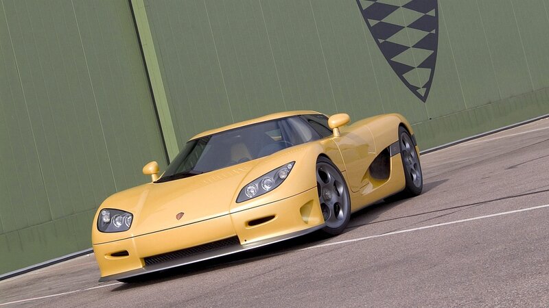 yellow sports car on track