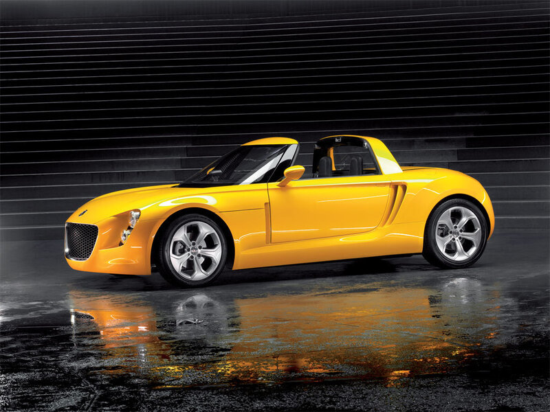 Yellow sports car on wet surface