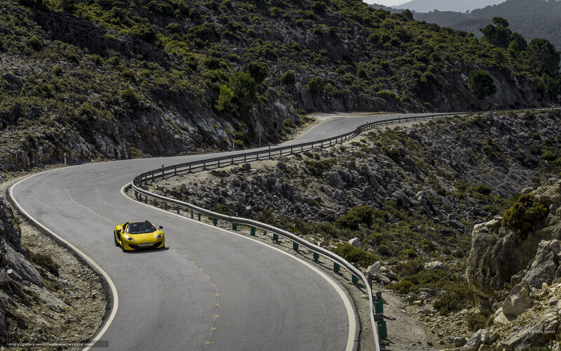 Yellow sports car on winding road