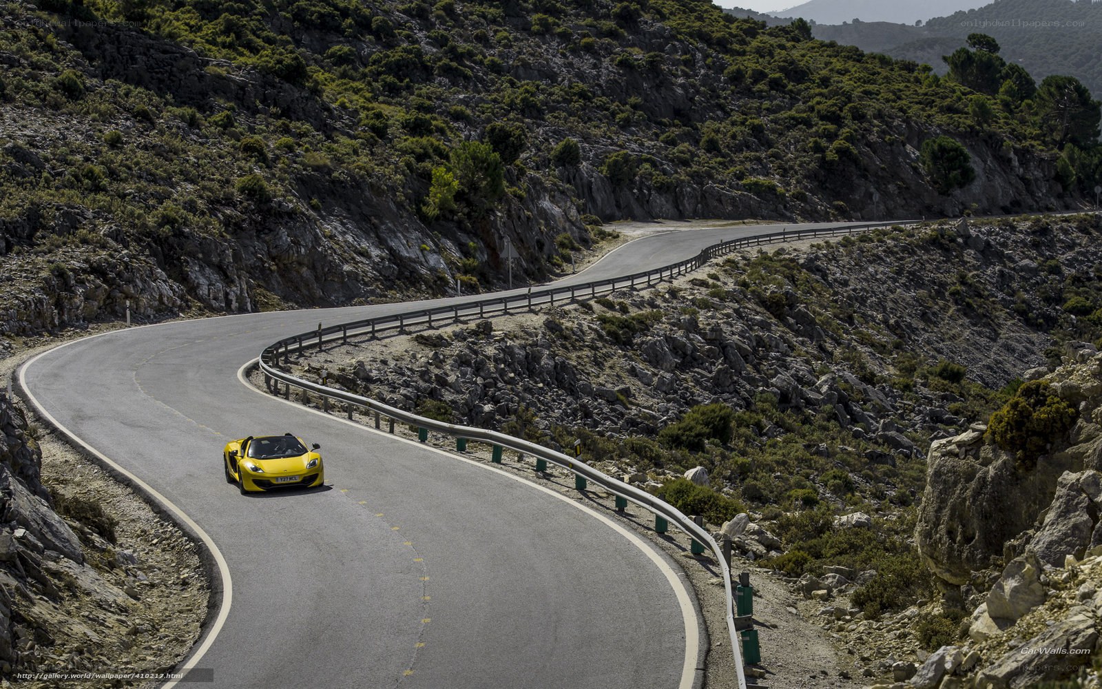 Yellow sports car on winding road