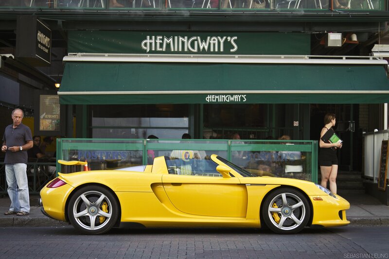 Yellow sports car outside restaurant