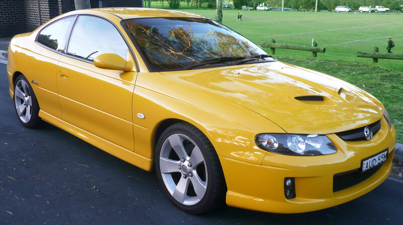 yellow sports car parked
