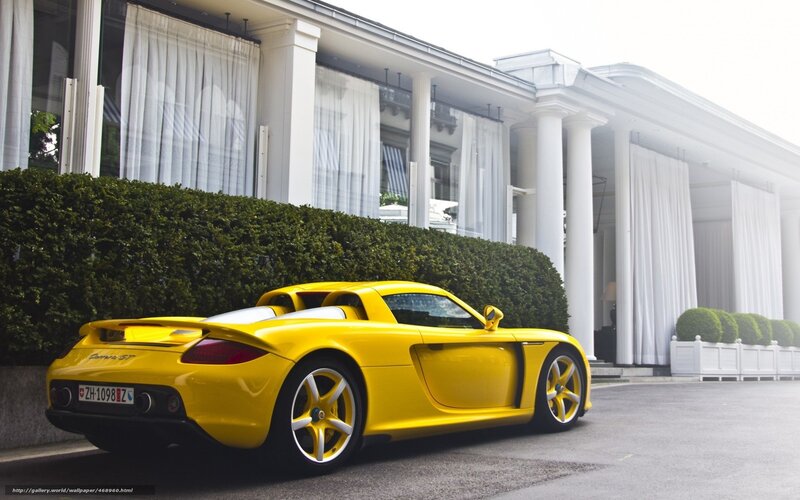 Yellow sports car parked outside