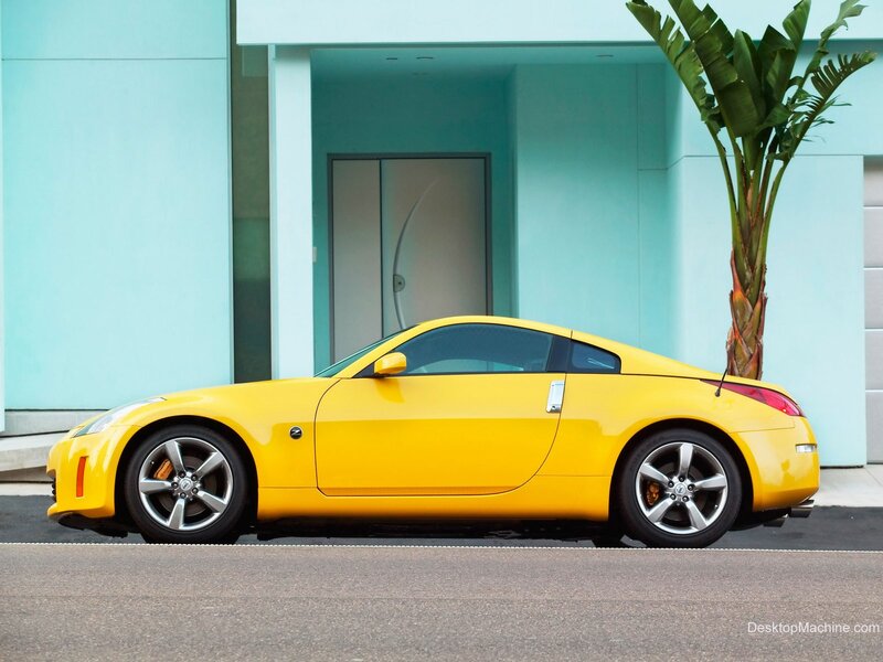 Yellow sports car parked outside