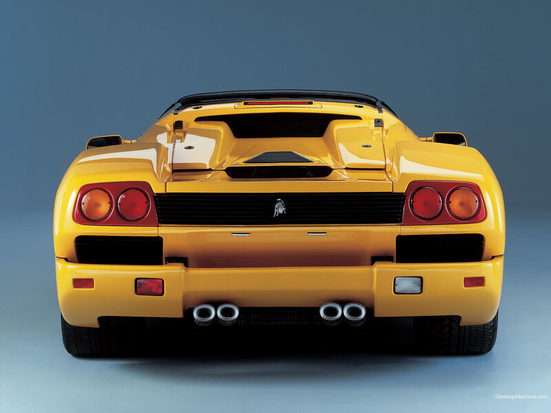 yellow sports car rear view