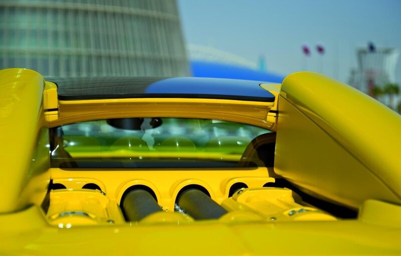 yellow sports car rear view