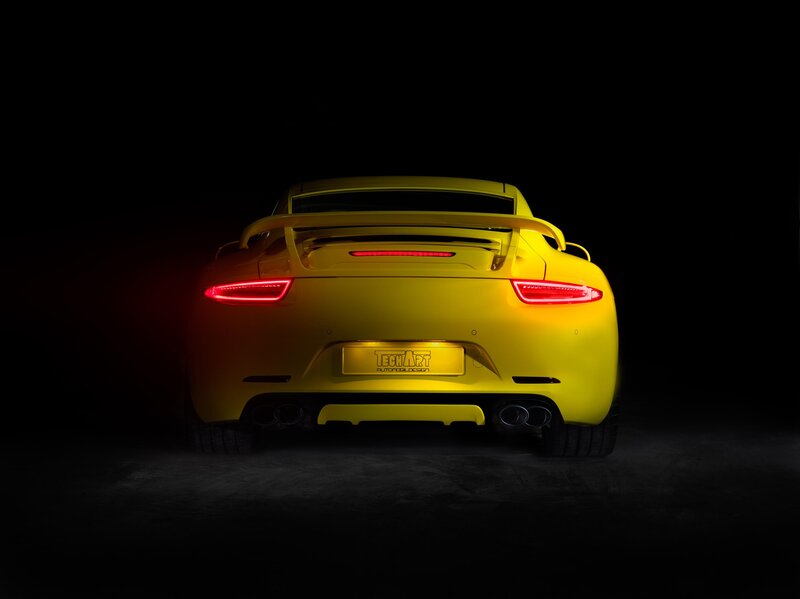 yellow sports car rear view