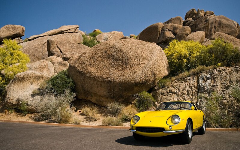 Yellow Sports Car — Serene, Afternoon, Photograph, Rock Formations, Bushes