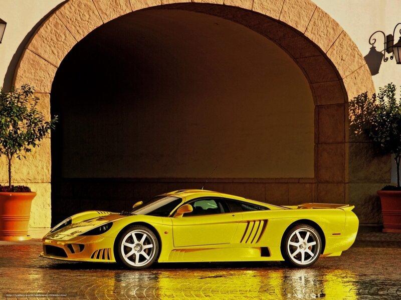 Yellow sports car under arch