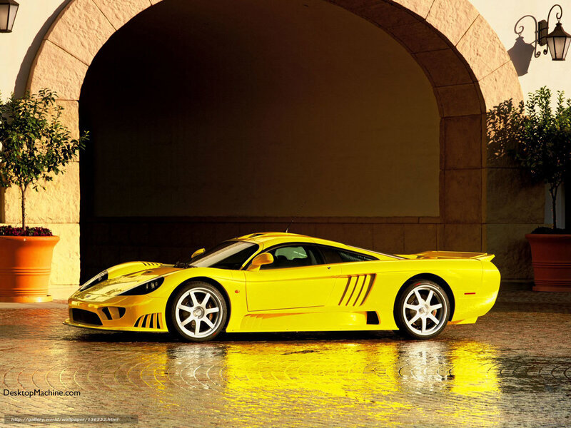 yellow sports car under arch