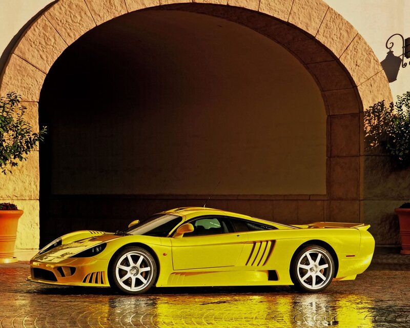 Yellow sports car under archway