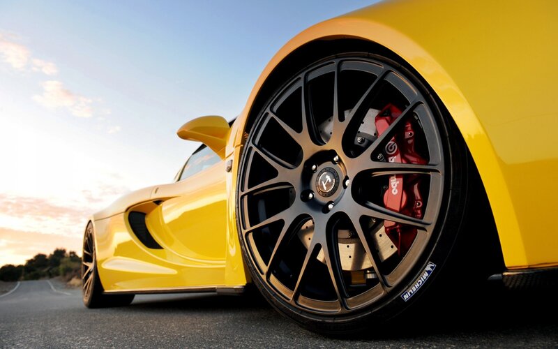 Yellow Sports Car Wheel — Dramatic, Sunset, Photograph