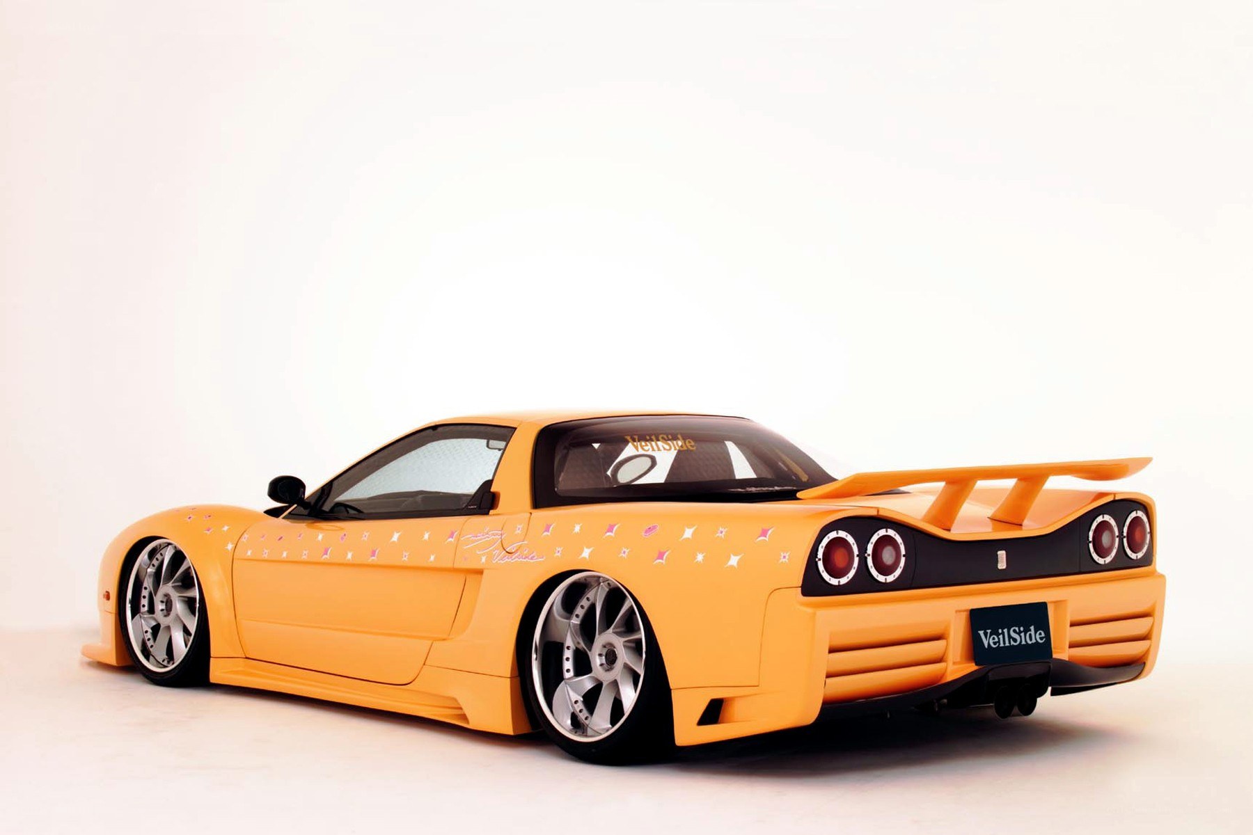 yellow sports car with decals