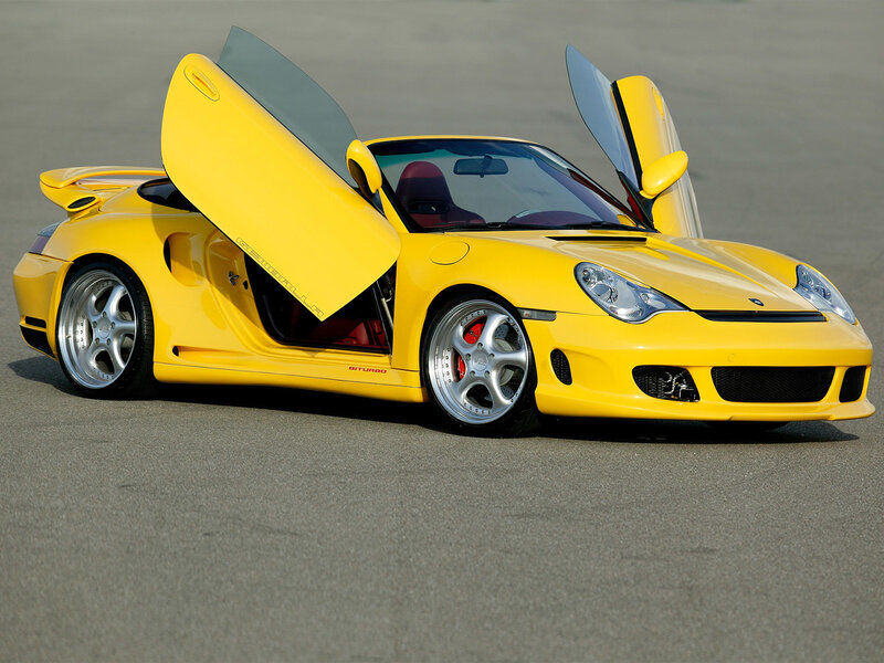 Yellow sports car with open doors