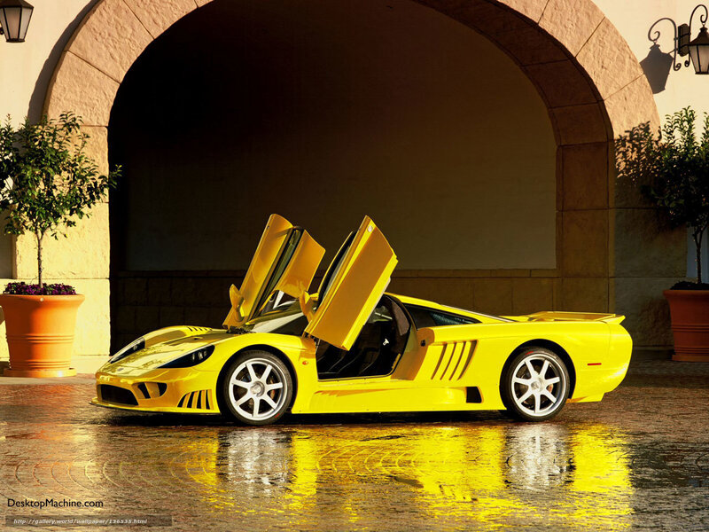 Yellow sports car with open doors