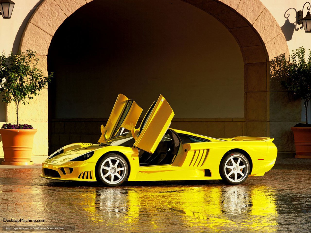 Yellow sports car with open doors
