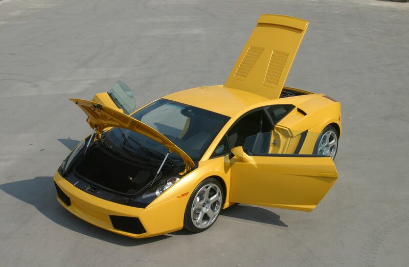 yellow sports car with open doors