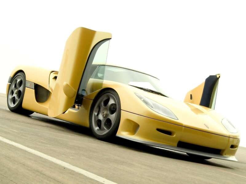 yellow sports car with open doors