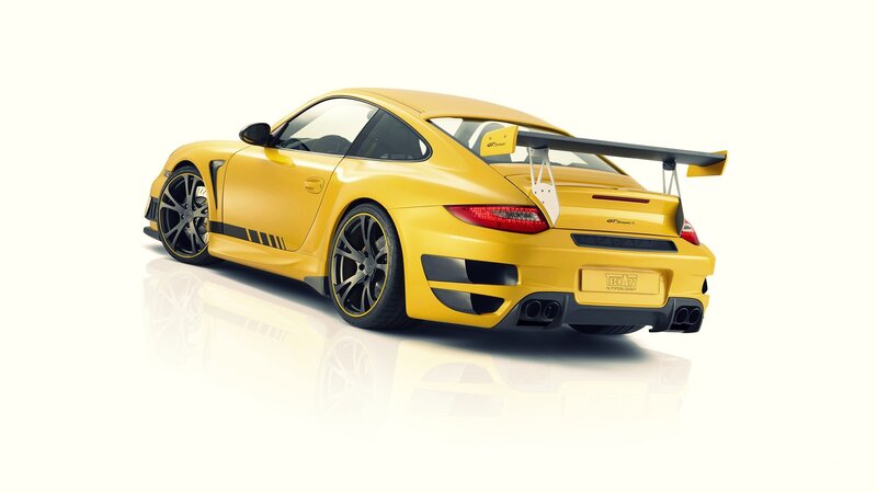 yellow sports car with rear wing