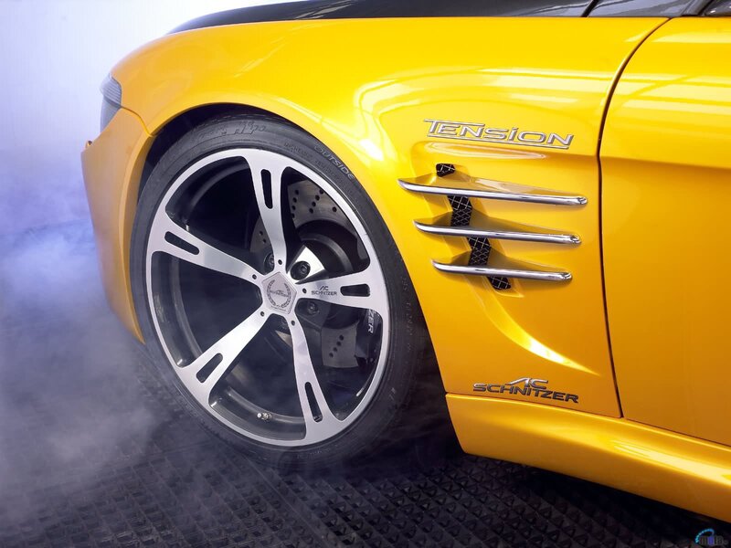Yellow sports car with smoke