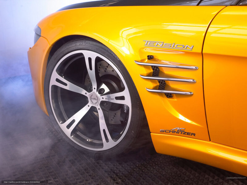 yellow sports car with smoke