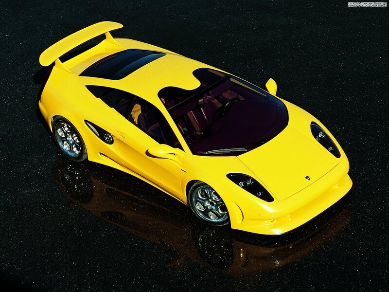 yellow sports car with spoiler