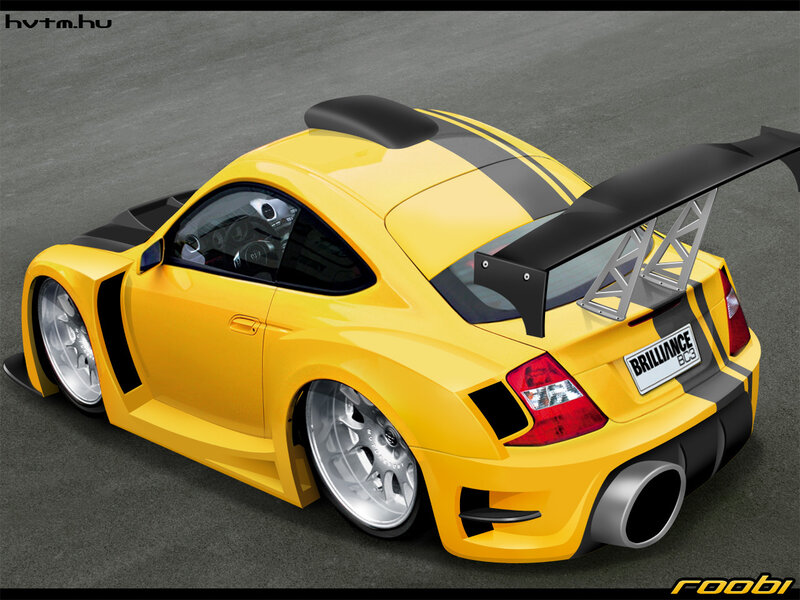 yellow sports car with spoiler