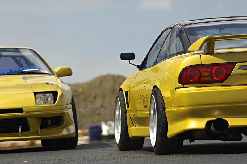 Yellow sports cars on track