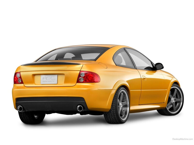 yellow sports coupe rear view