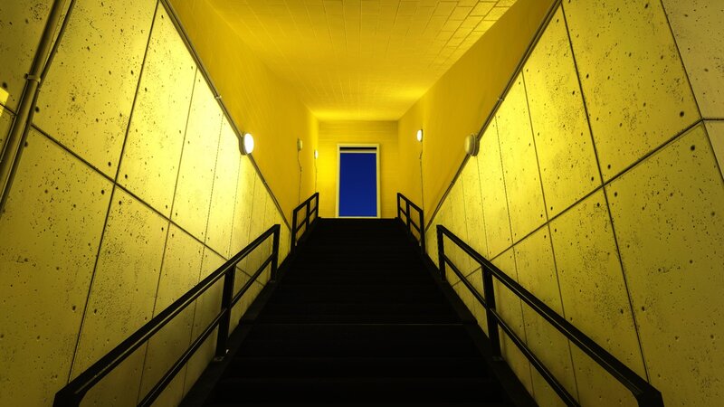 yellow stairwell with blue door