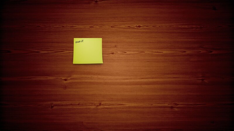 yellow sticky note on wood