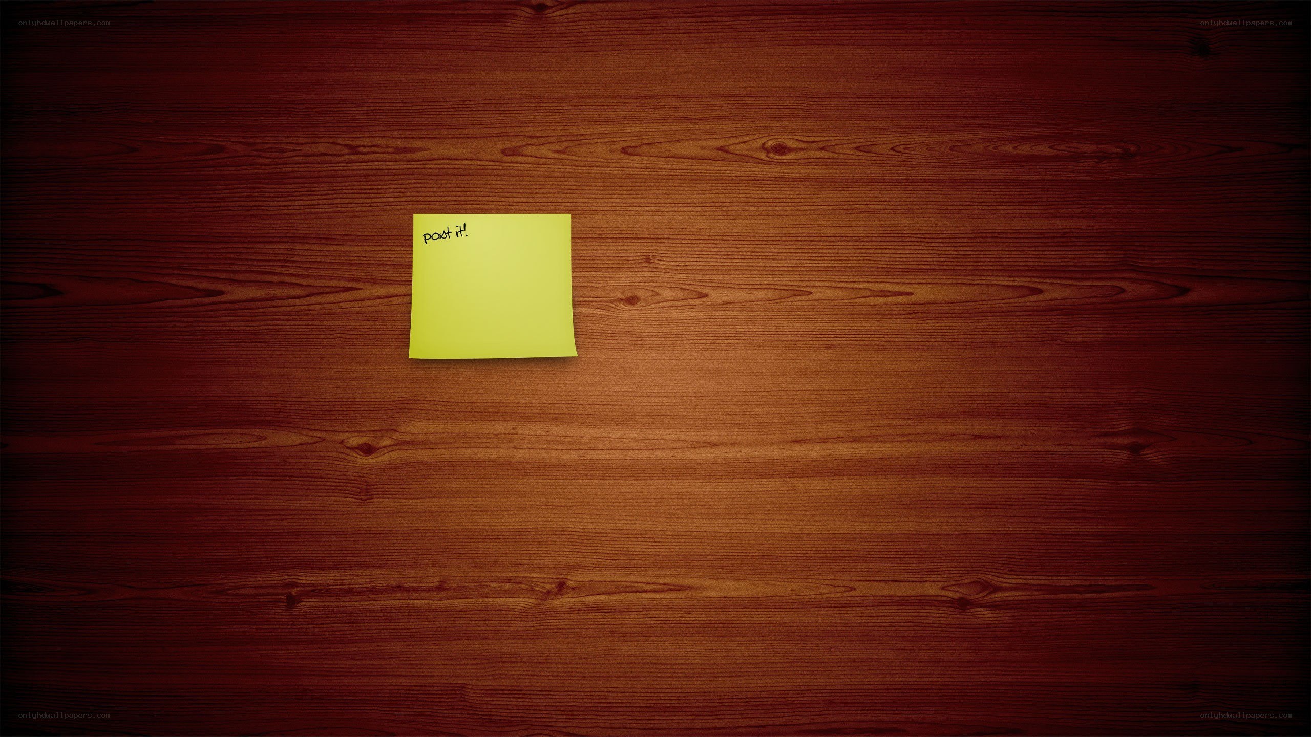 yellow sticky note on wood