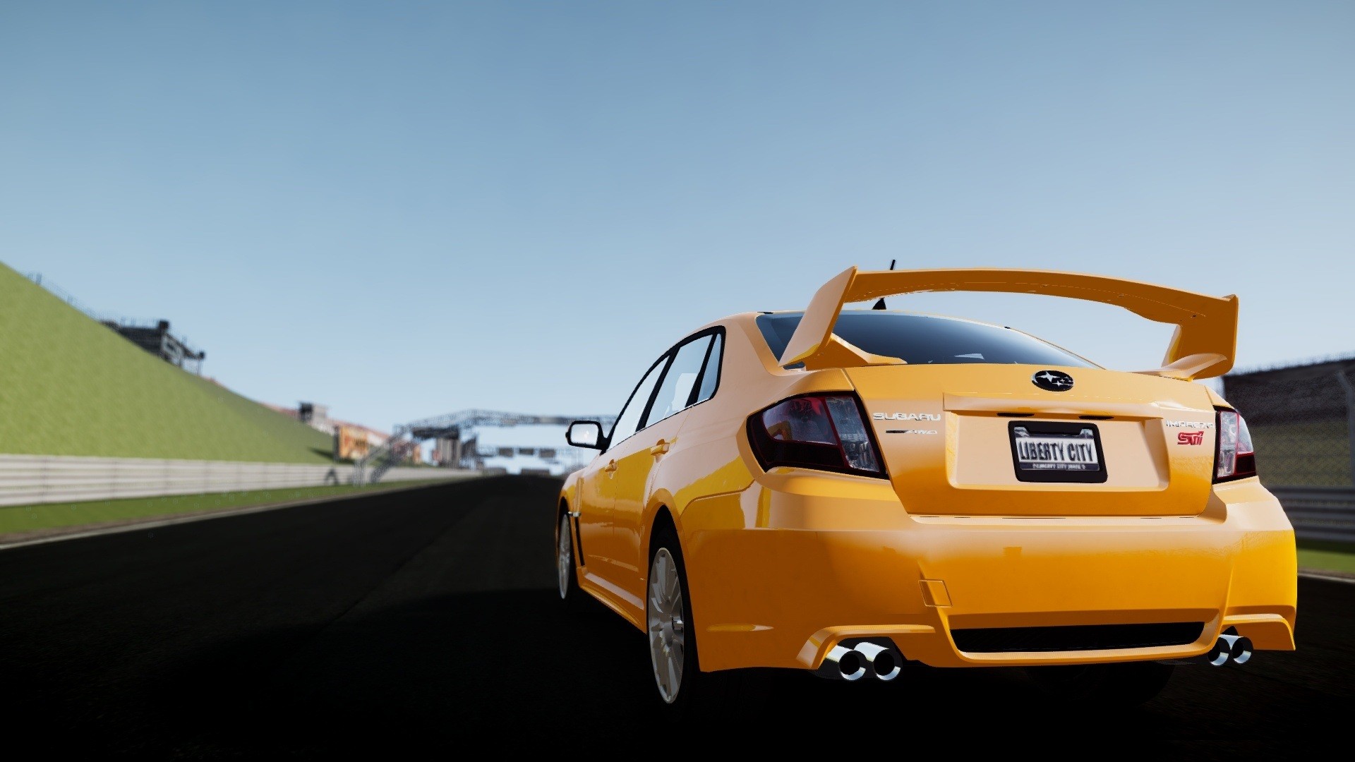 yellow subaru on racetrack