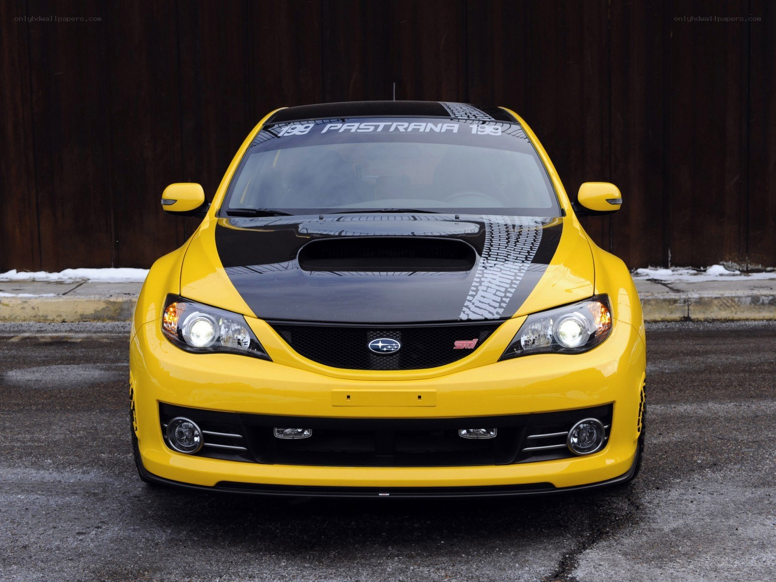 yellow subaru sti car