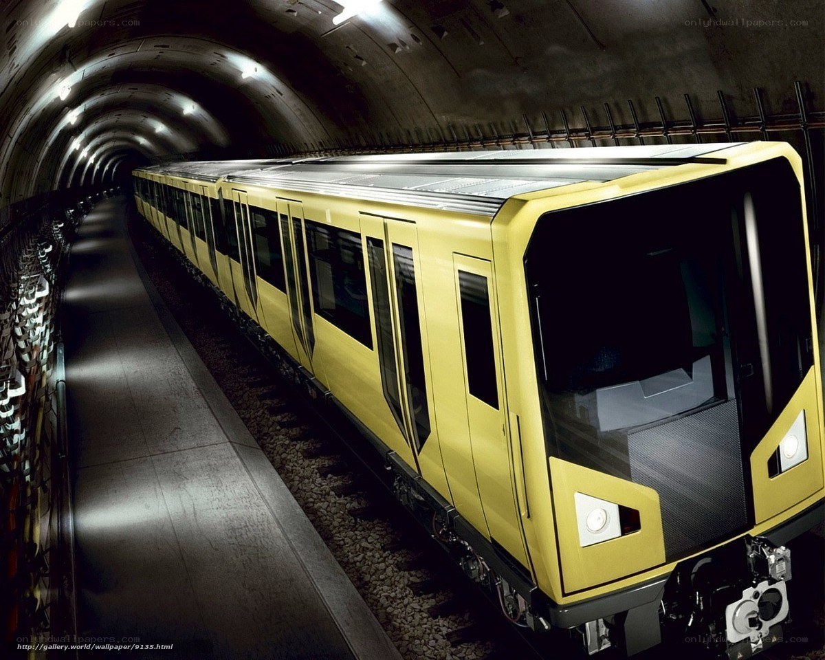Yellow subway train in tunnel