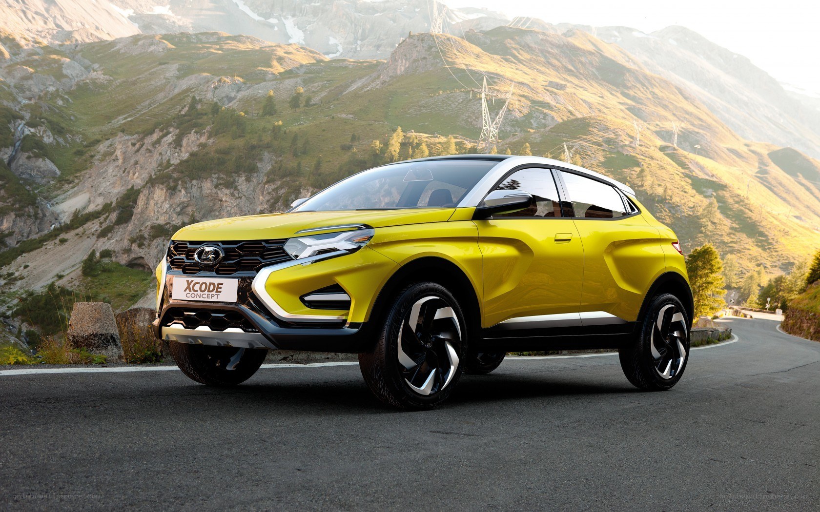 Yellow SUV on mountain road