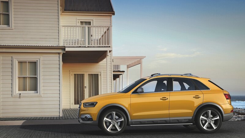Yellow SUV parked by beach house