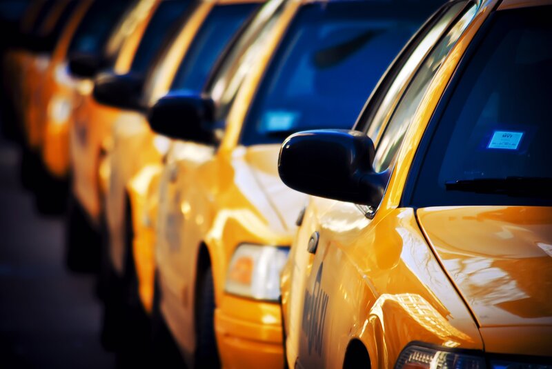 yellow taxi cabs in a row