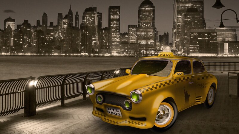 Yellow taxi in city at night