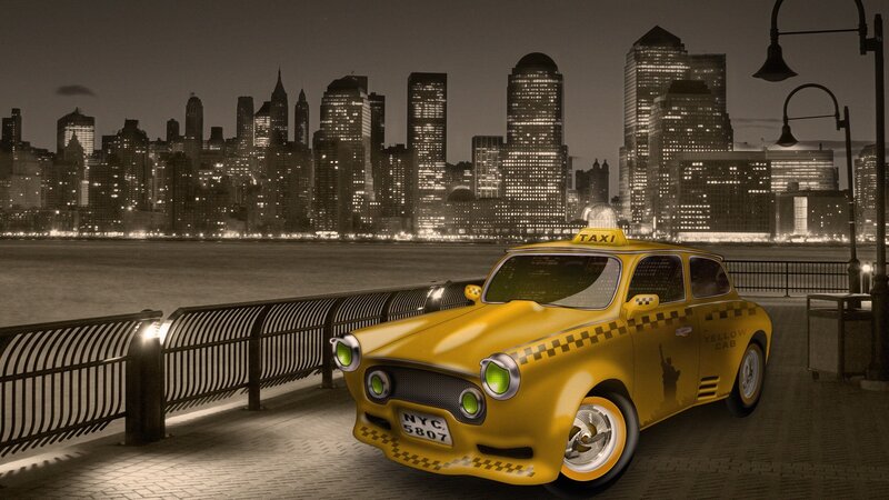 Yellow taxi in city at night