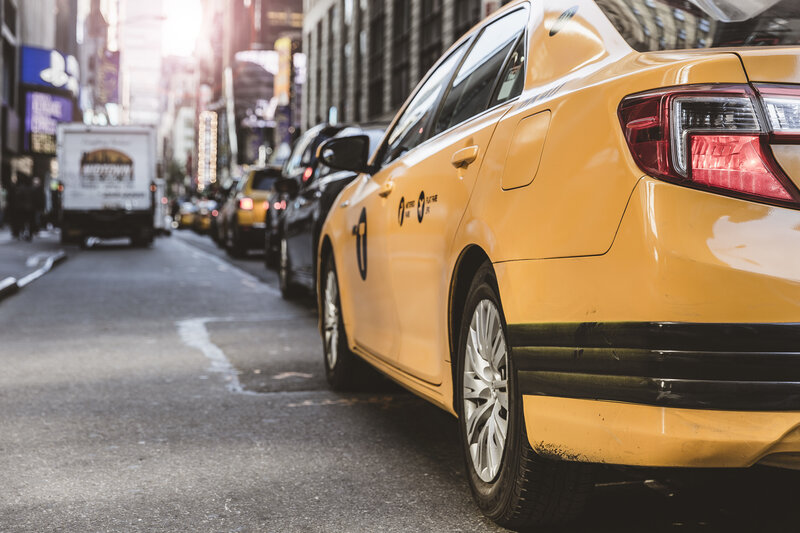 Yellow taxi on city street