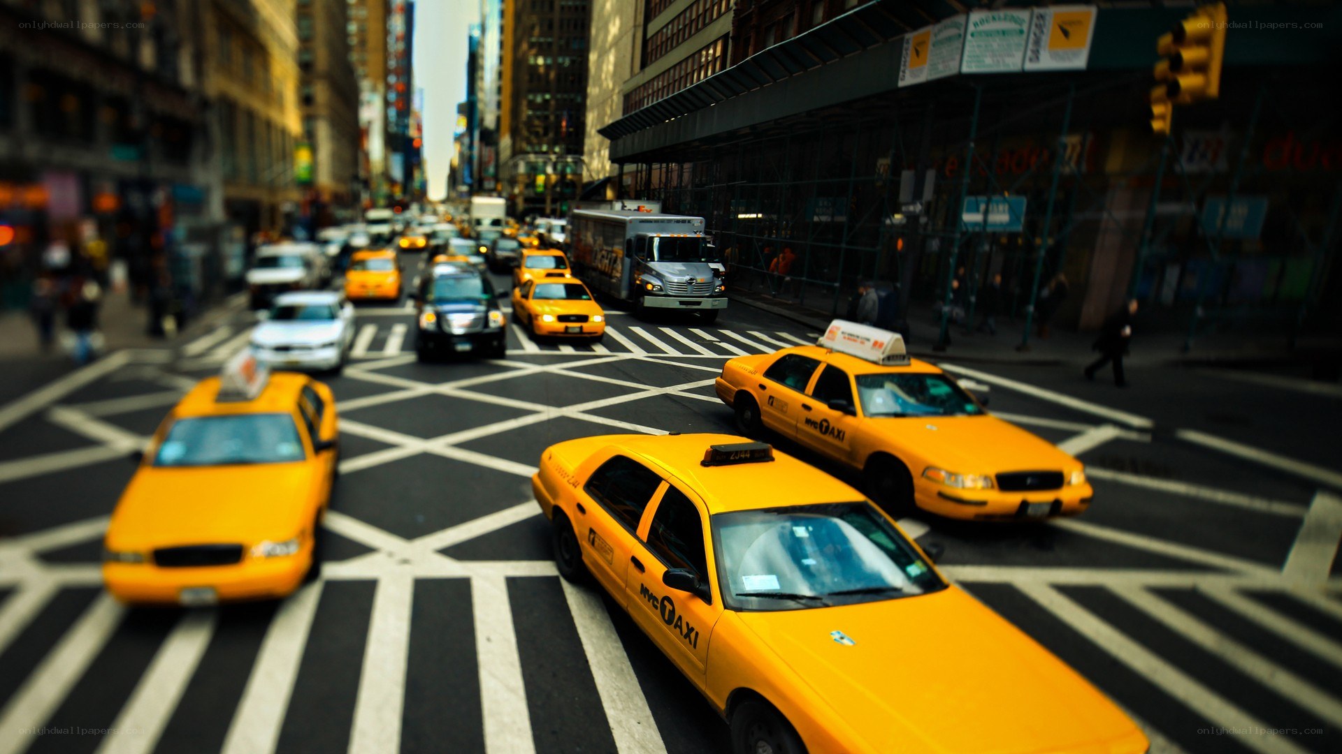 Yellow taxis at city intersection